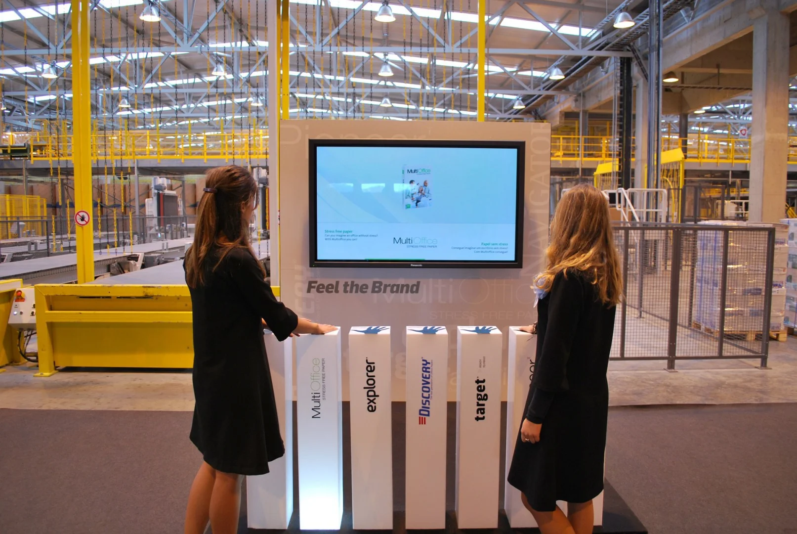 Interactive display with two visitors at the paper mill.
